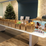 Heres our assembly line of all the items going into each box more than 30 items per box. It was our way of stayig organized and making sure everyong got a nice gift box. 150x150 USO Military Care Packages